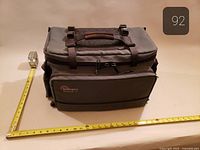 Exterior of Lowepro camera bag with measuring tape for scale