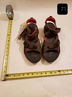 Top view of new Merrell Chameleon sandals with measuring tape for scale