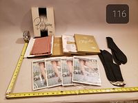 All stockings packages, boxed stockings, and tabi socks displayed with measuring tape for scale