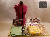 Front view of lot showing dress form, yarn, patterns, fabrics, templates