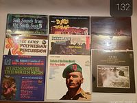 All eight sealed vinyl records displayed front covers