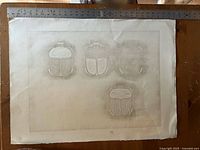 Full view of unframed blind-embossed print on table