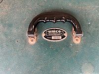 Close-up of Umco 205U tackle box handle and badge