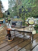 Group view showing coffee table, weathervane pole, sunflower thermometer and additional metal components