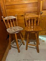Front view of both wooden swivel stools