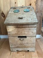 Front view closed showing rustic pine finish and two pulls