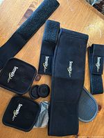 Set laid out showing belt, pads, extenders, loose magnets