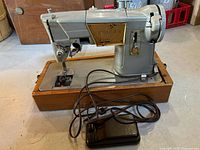 Singer 328J sewing machine on wood base with foot pedal and cord