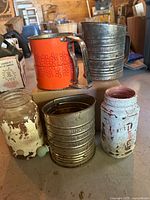 Front view of all four pieces showing two sifters and two jars