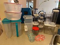 All containers grouped on countertop, showing sizes and lid colors
