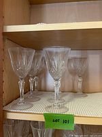 Wine goblets on upper shelf