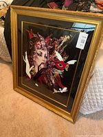 Full view of framed print showing gold frame, black mat, art inside
