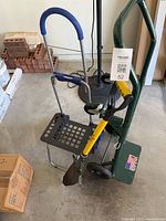 All three items grouped: green Harper hand truck, blue stair cart folded, yellow Spear Head Spade