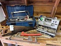 Overall lot: tools spread on bench with panel saw, pipe wrench, organizers