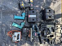 Overall view of all tools and chargers on tarp