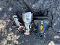 Electro airless paint gun and WEN polisher with cords laid out