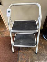 Front view showing both steps and handrail