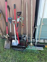 Group view of all garden tools leaning against wall