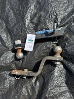 Both hitch ball mounts with balls and pins visible