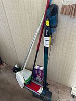 Full lot showing vacuum, two mops, box of pads
