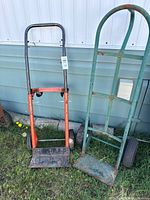 Both hand trucks standing side by side
