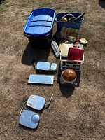 Overview of lot showing totes, crate, mirrors, emergency light