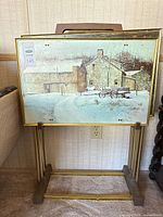 front view of stacked trays on stand showing artwork