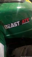Side view showing Beast ATV Standard decal on green body