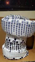 Comforter rolled in retail package showing overall pattern