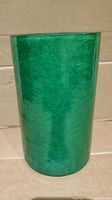 Full side view of cylindrical green crackle glass shade