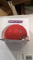Front of box showing red Smart Cat Toy ball
