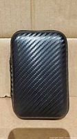 Front of carbon-pattern EVA carrying case