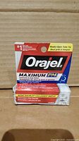 Front view of Orajel Maximum Strength PM packaging