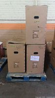 Three sealed cardboard cartons marked 48 V on pallet
