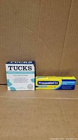 Front view of Tucks pads box beside Preparation H ointment box