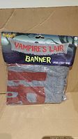 Front of packaged Vampire's Lair banner showing branding and dimensions