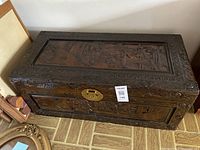 Overall view of carved wood chest