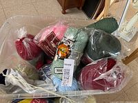 Large tote filled with various yarn skeins and balls