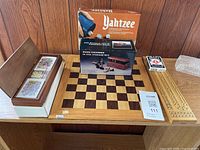 Chessboard, Yahtzee box, chessmen box, wood card box, playing cards, cribbage board