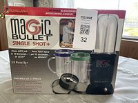 Front of sealed Magic Bullet Single Shot+ box showing contents and 12-piece count