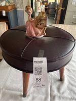 Stool and figurine together showing scale and general condition