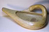 Left front view of soapstone goose bowl showing interior cavity and neck