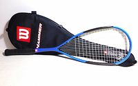 Racket with case showing branding and overall condition