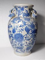 Full view front of blue and white floral vase