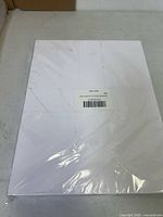 Front view of sealed pack of white cardstock