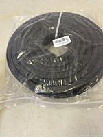 Coiled rubber seal in unopened plastic bag
