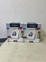 Front view of two Miele AirClean 3D Efficiency GN XL Pack boxes