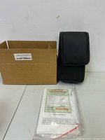 Cardboard box, black pouch, certificate, manual
