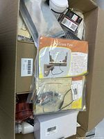 Overview of box contents showing Cross Fire sheet, jars, memory card, small parts