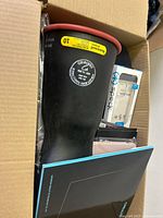 Overview showing plunger cup, packaged phone accessories